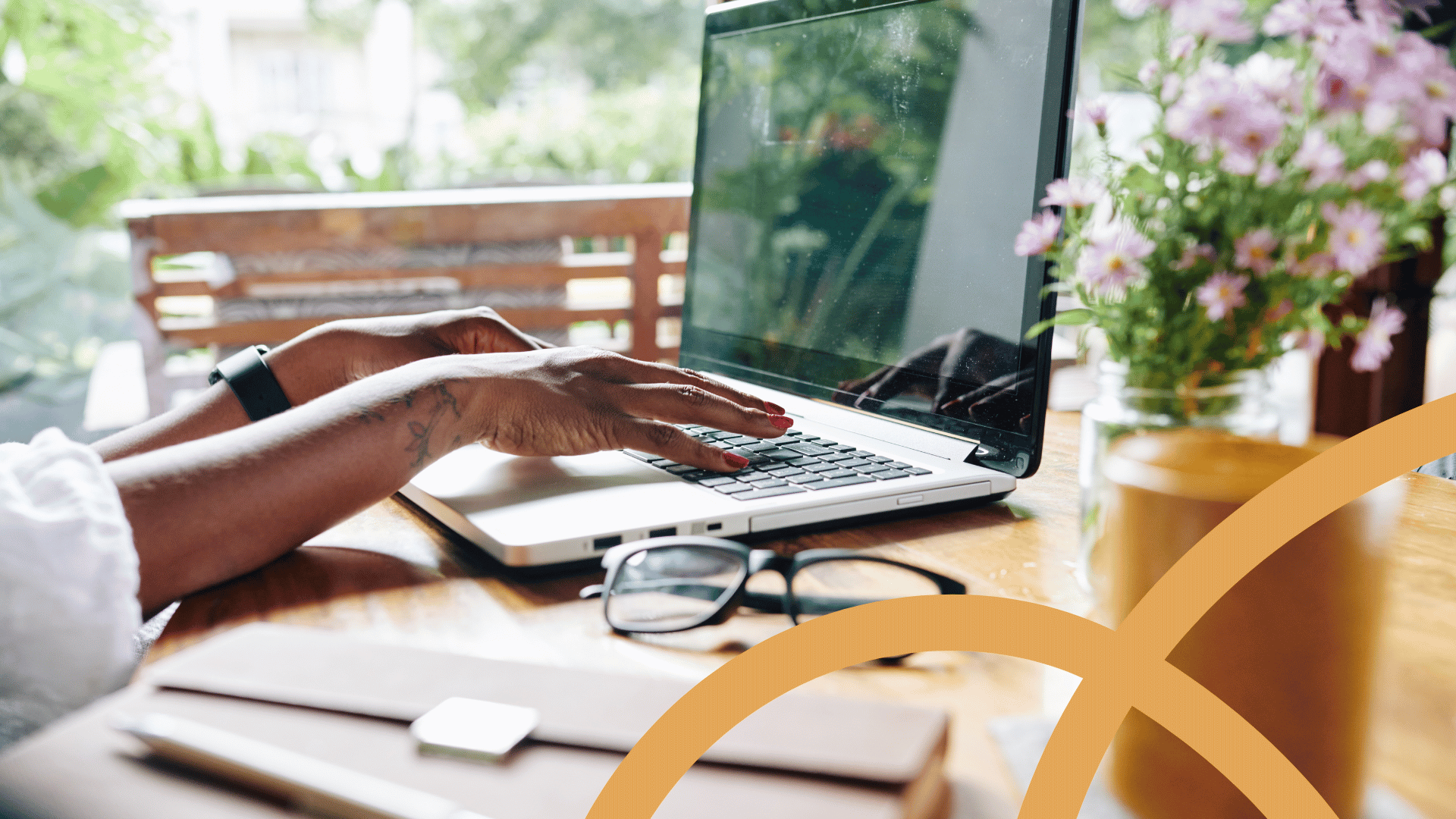 A remote employee works happily on her laptop, illustrating remote worker best practices in HR for small businesses.